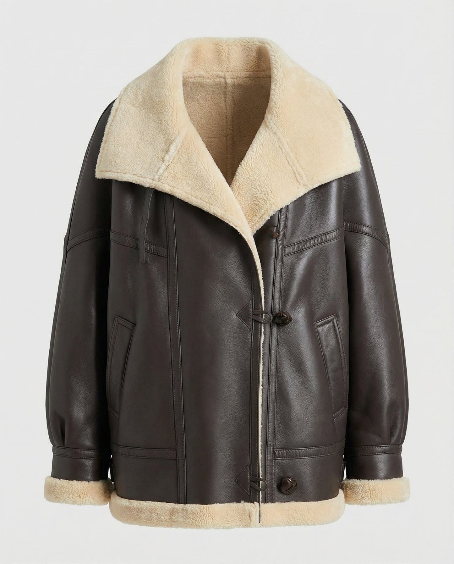 Brown leather jacket with beige shearling collar and cuffs on a white background
