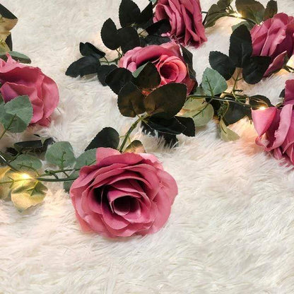 Dekorativa rosenvinslingor med ljus | Veska violett ros