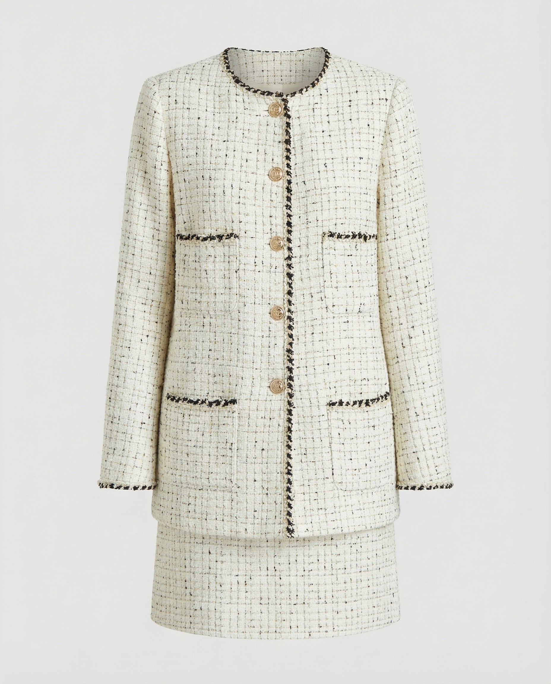 Tweed jacket and skirt set on a light gray background