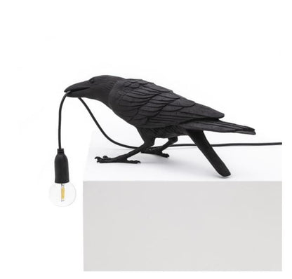 Raven Vägglampa | Veska Svart sittande